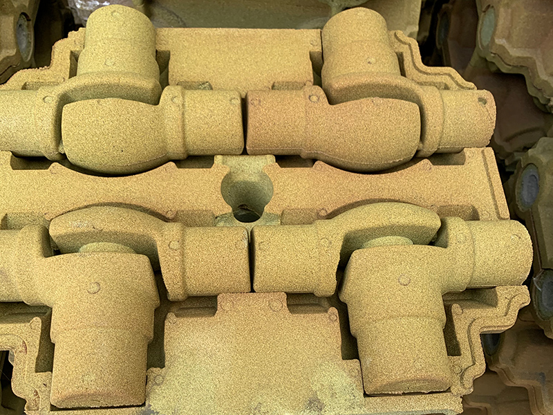 Paano malulutas ang buhangin na nakadikit na depekto sa paggawa ng mga grey cast iron na bahagi gamit ang film coated na teknolohiya ng buhangin?